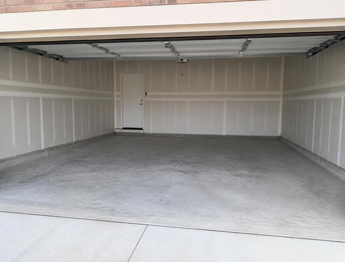 Empty swept garage in Craigieburn VIC after rubbish removal by SWIFT